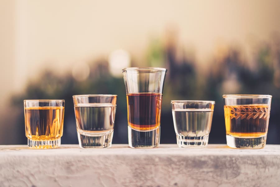 Shot Glasses Filled With Liquor And Spirits