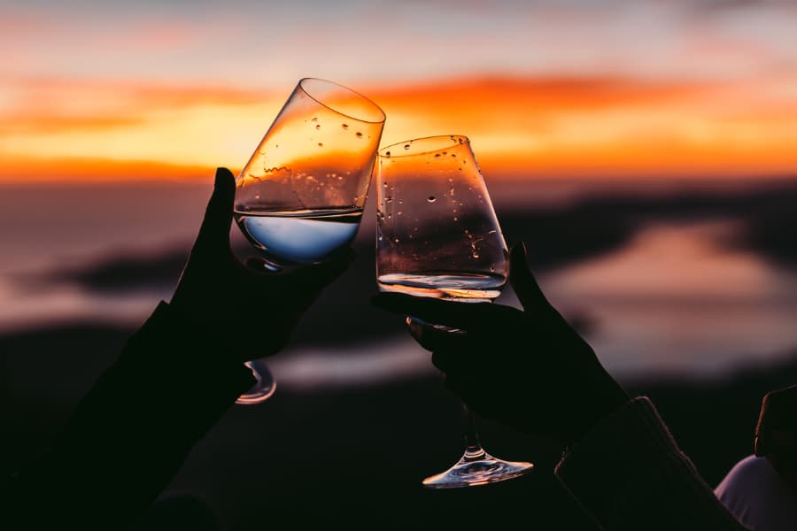 Couple Drinks Wine At Sunset
