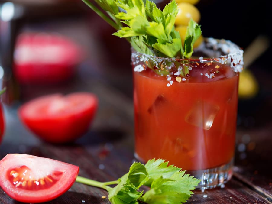 Bloody Mary cocktail with sliced tomato