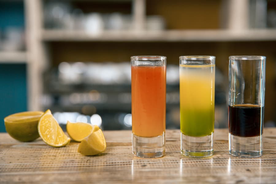 Three malternative cocktails on a bar