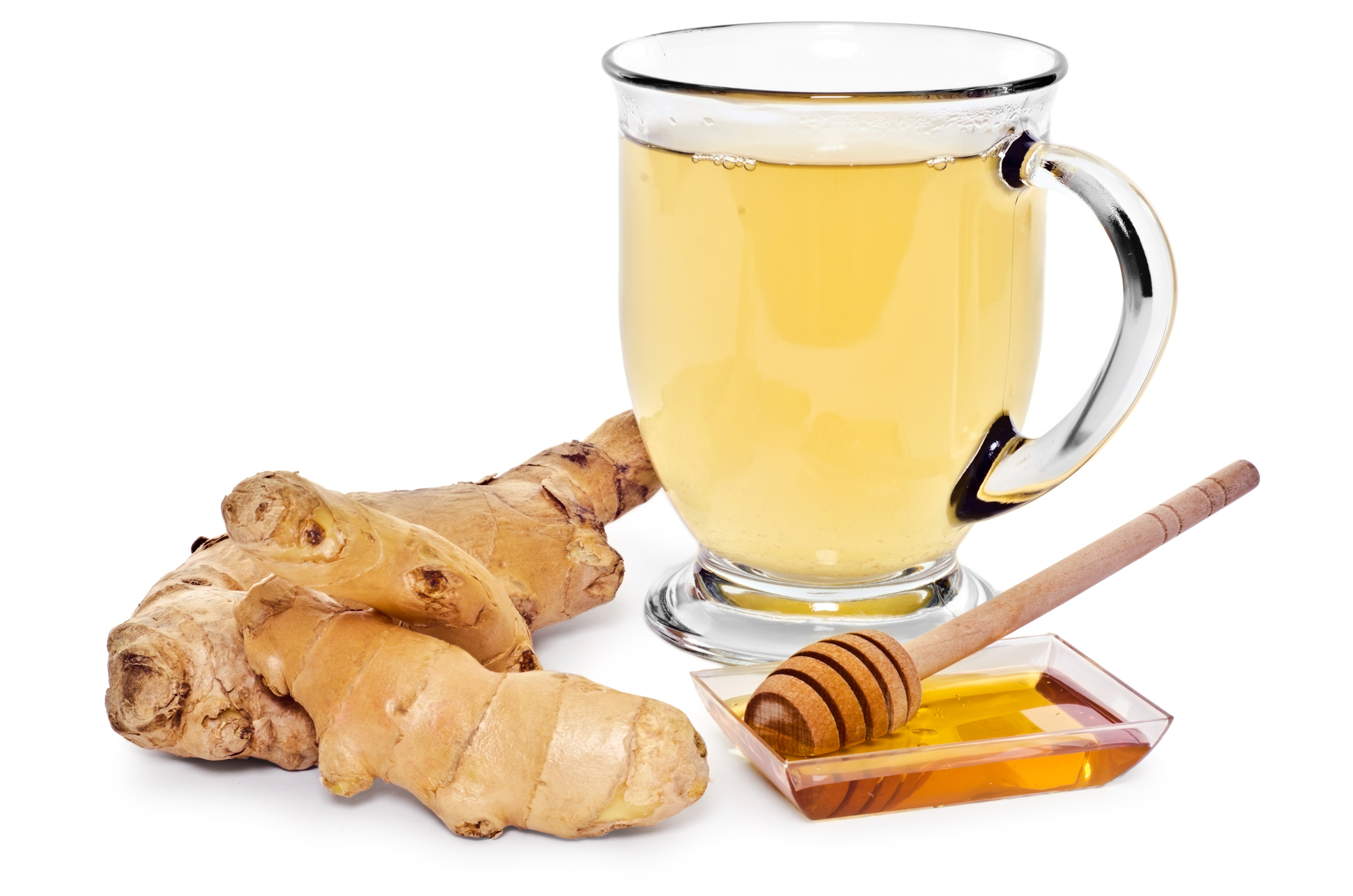 A glass mug full of hot ginger tea. Isolated on white.