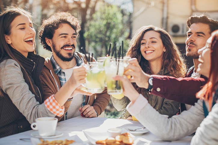 Group Of Friends Enjoy Cocktails.