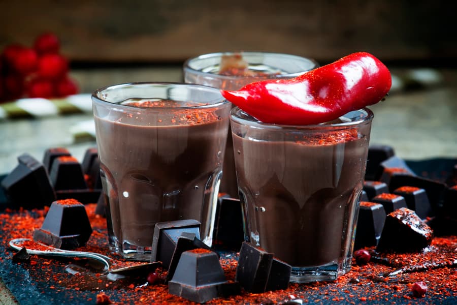 Mexican hot chocolate with blocks of dark chocolate and hot pepper