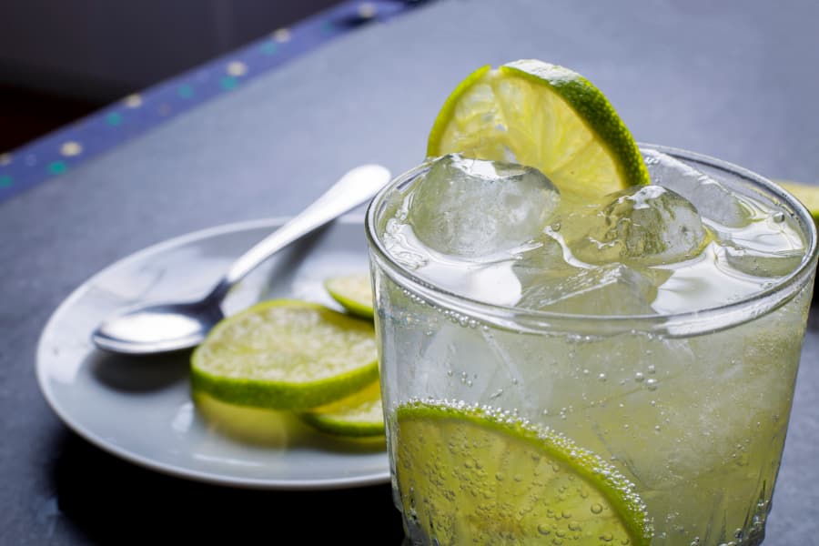 Slices of lime in a drink with ice