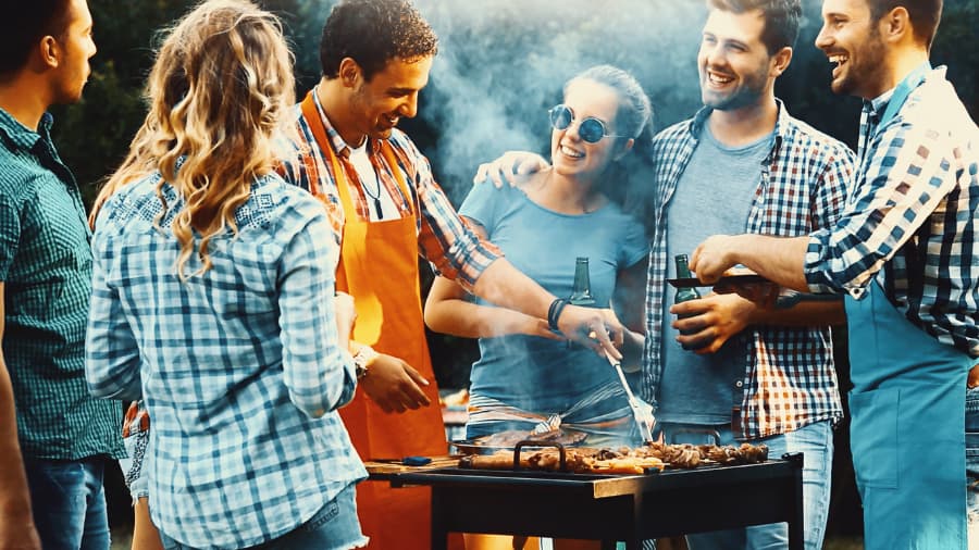 Friends Enjoying Drinks At Barbeque