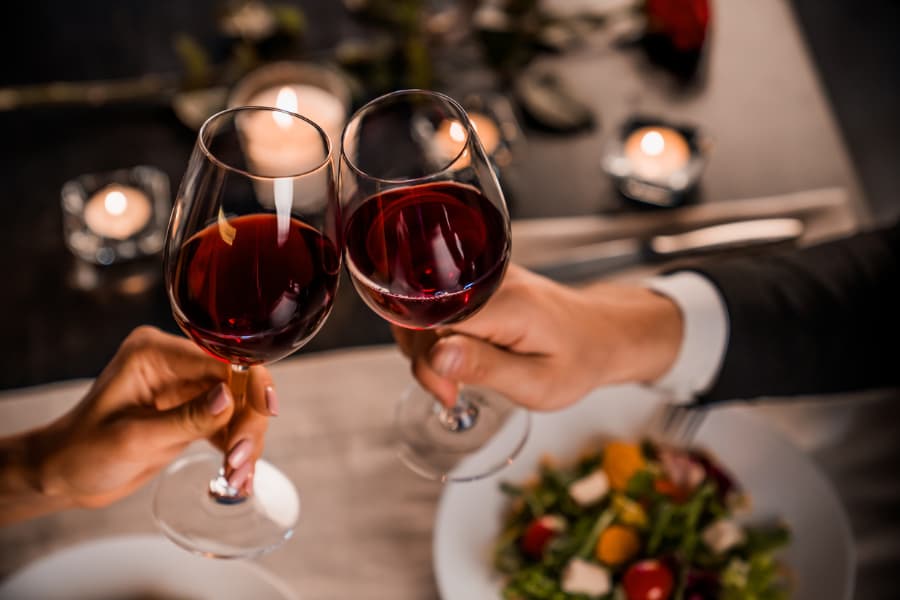 Couple toasting with wine glasses