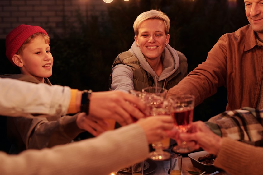 Family toasting glasses at party