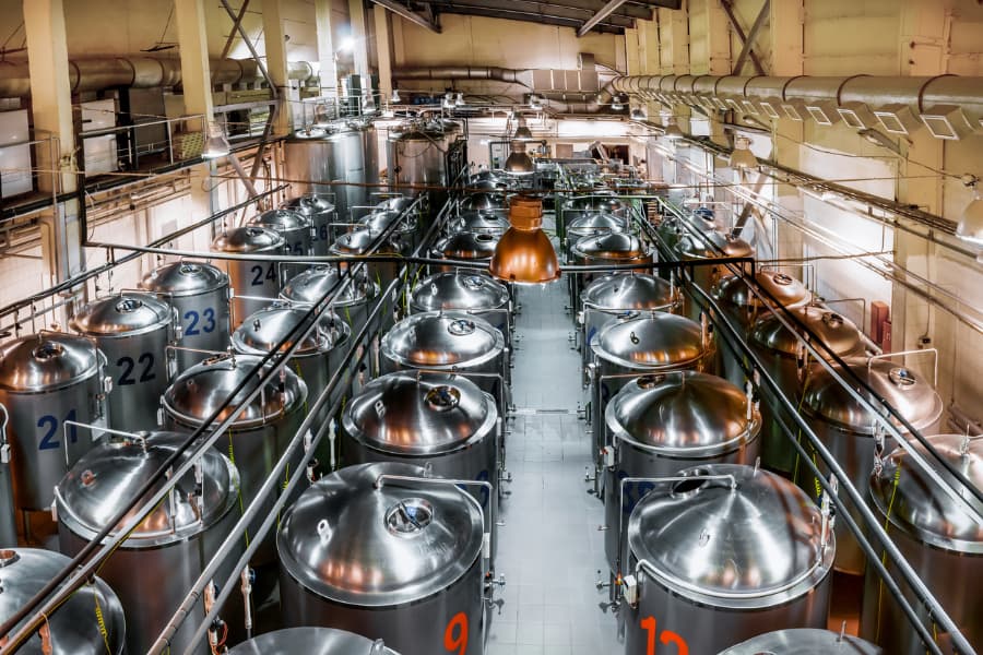 Beer production plant with several rows of steel tanks