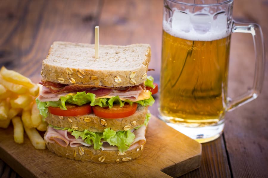 Sandwich paired with beer and French fries