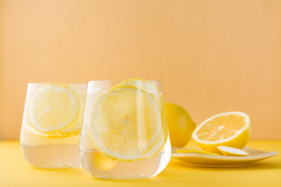 Two glasses of sparkling water with lemon slices
