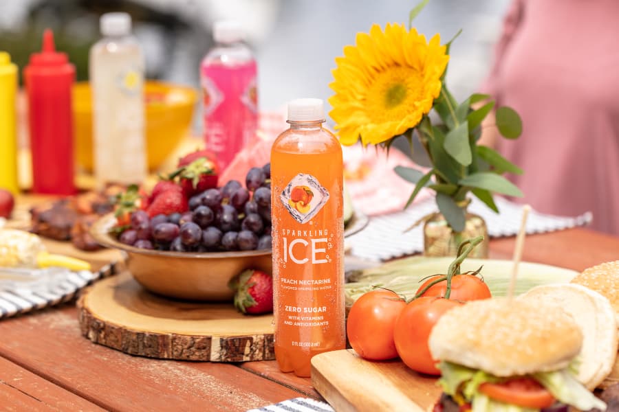 Sparkling Ice beverage on a table with food