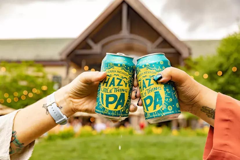 people cheersing Sierra Nevada Hazy IPA