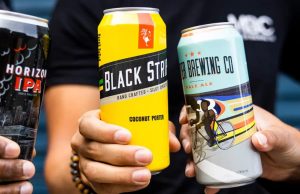 3 Metier beer cans cheersing
