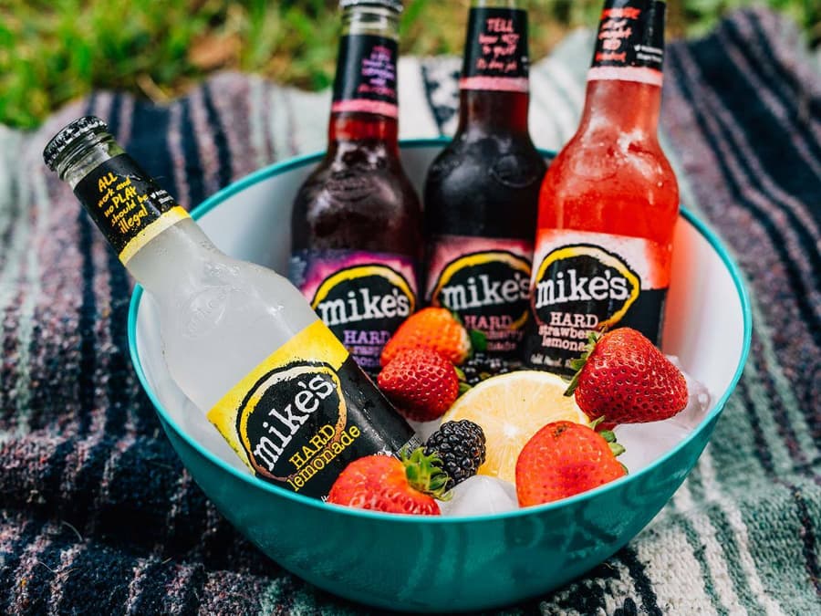 Mike's Hard Lemonade in an ice bowl with strawberries
