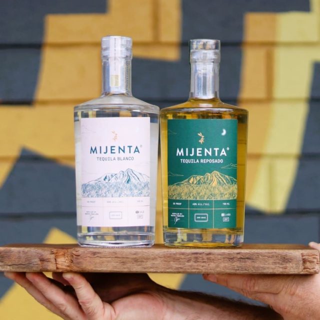 two bottles of mijenta tequila