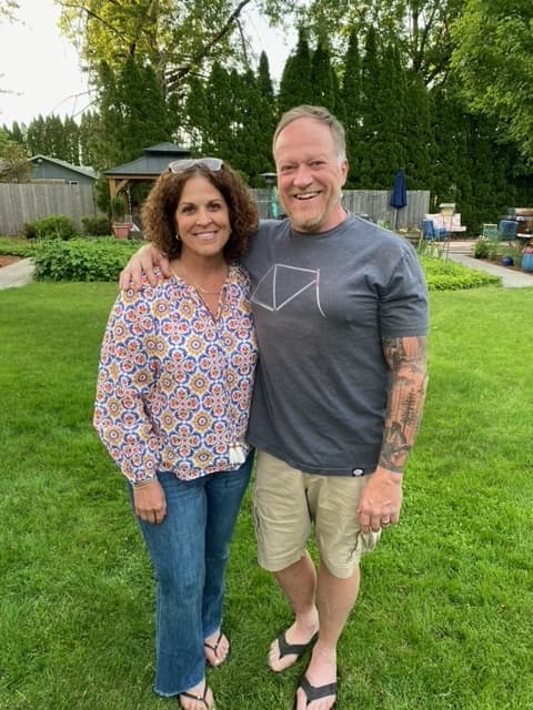 Columbia Distributing delivery driver Darrell McCoy, with his wife
