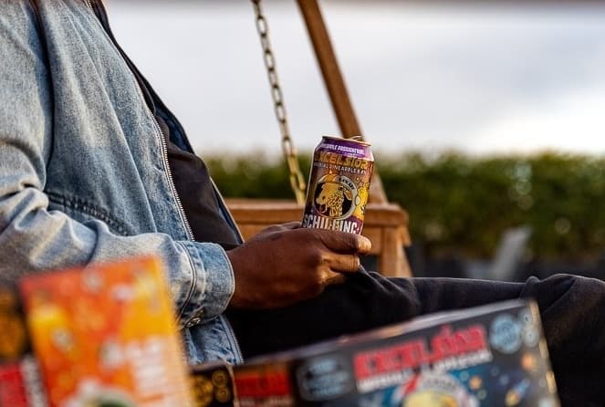 Man holding can of Schilling Hard Cider